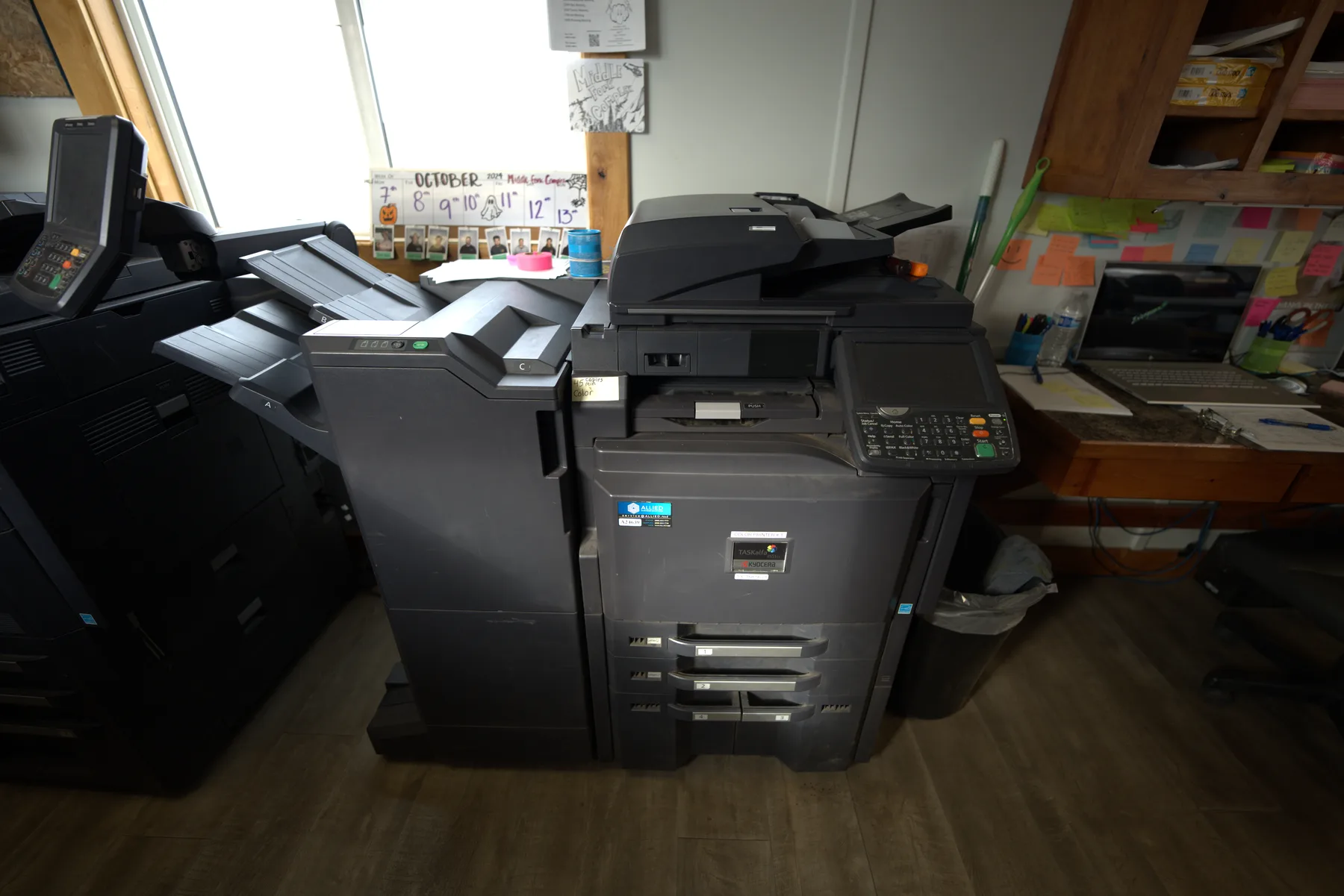 A copier and fax machine inside the Evergreen clerical trailer