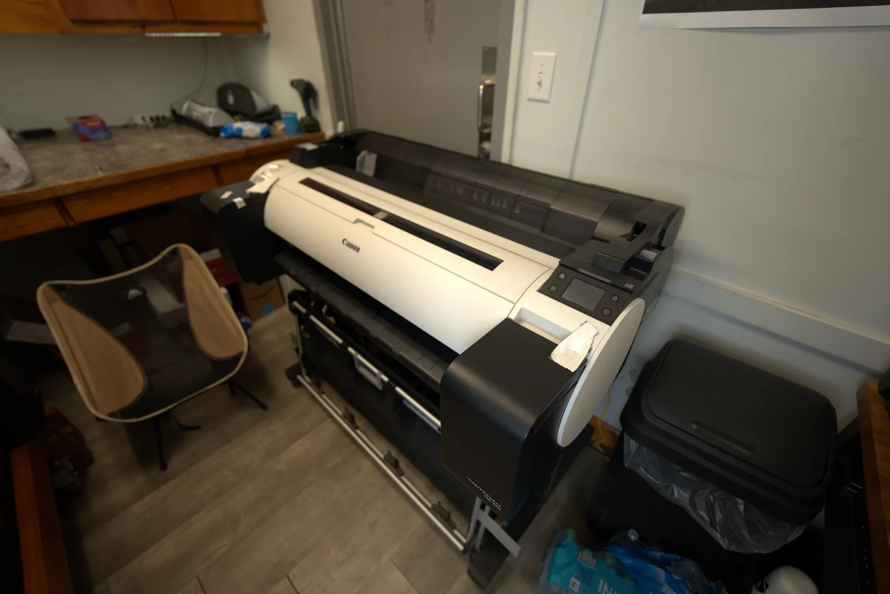 A 44-inch wide-format plotter inside the Evergreen clerical trailer