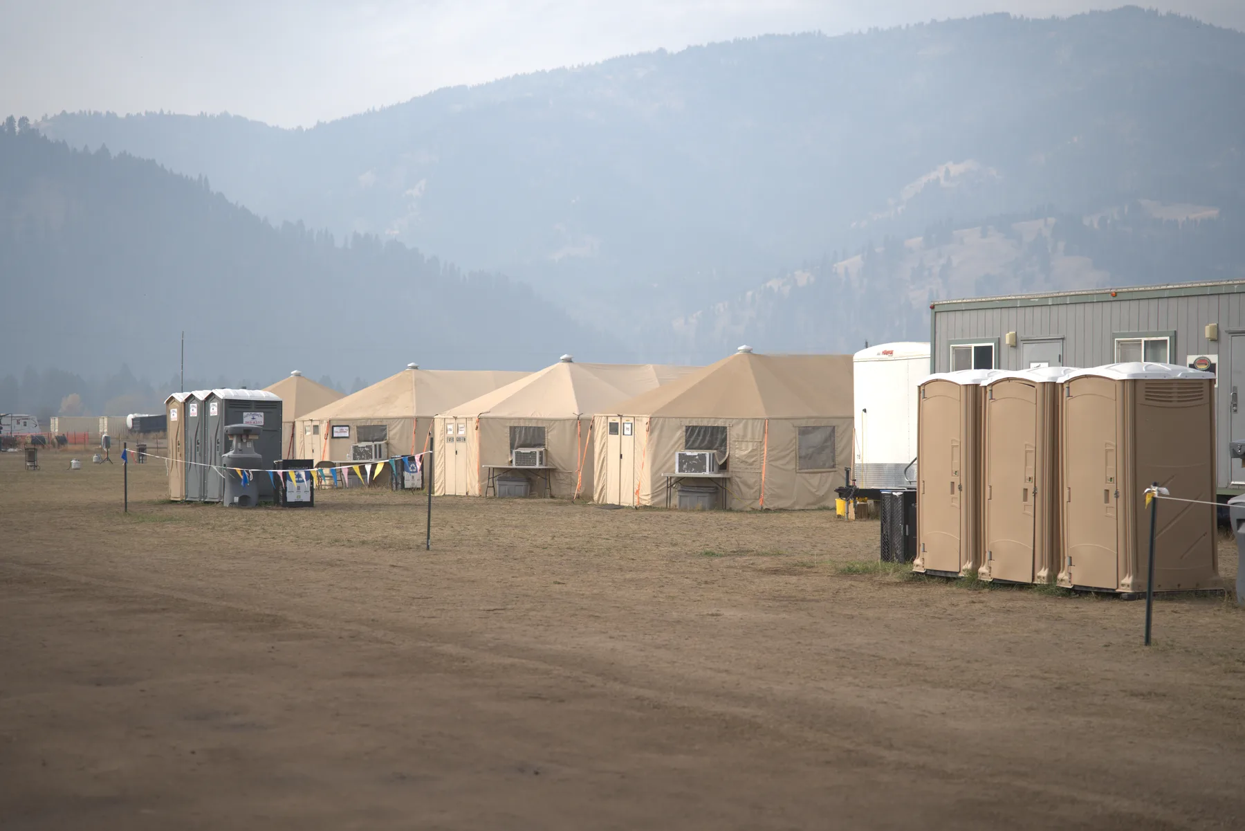 A wide view of an Evergreen Resource base camp on a smoky day