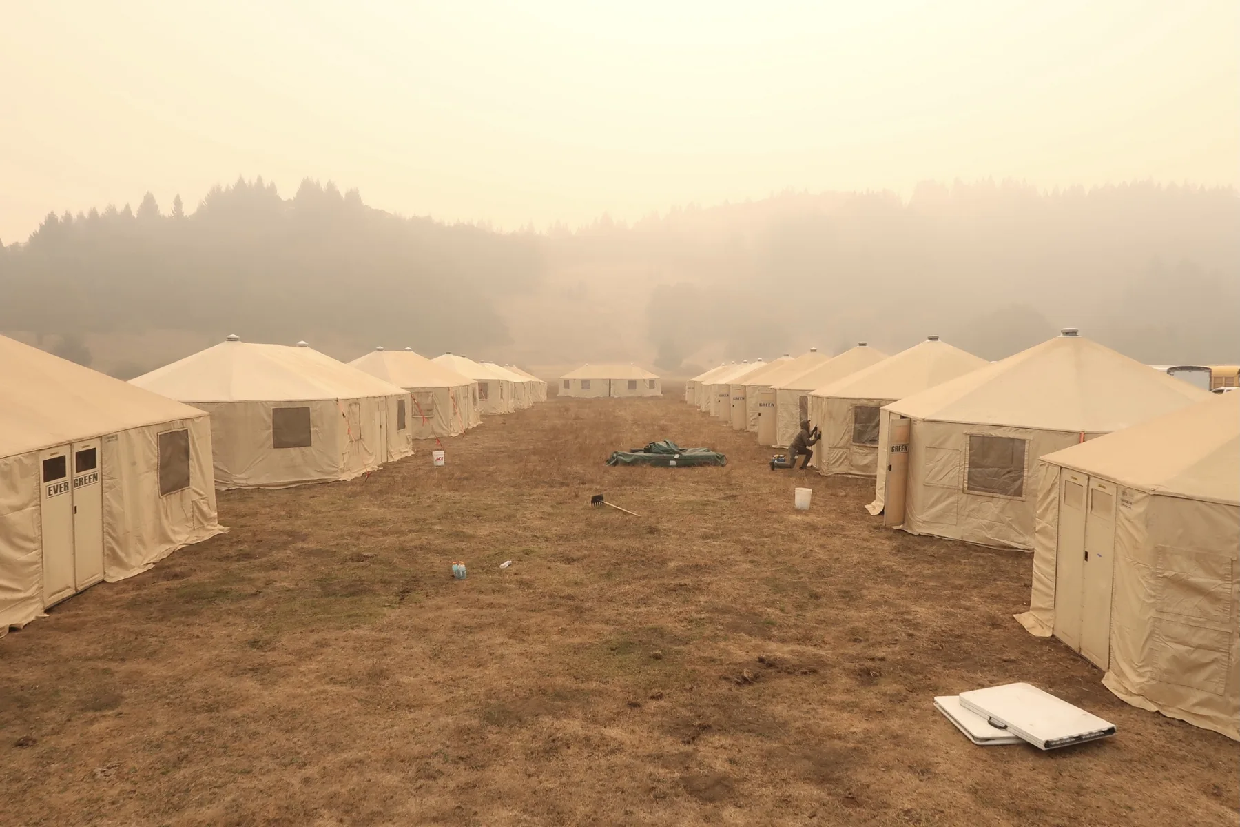 A long alley of Evergreen Resource yurts during heavy smoke